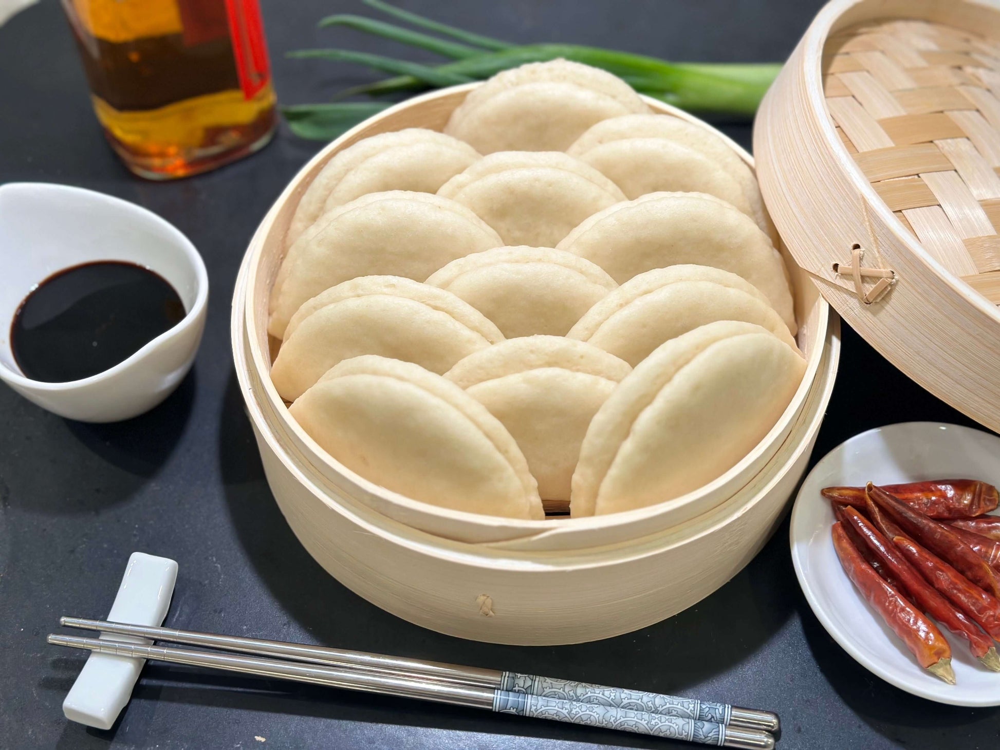 12 pack of gluten free baos in a bamboo steamer